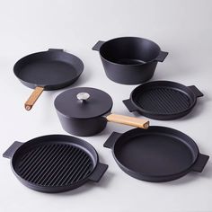 an assortment of cooking utensils and pans