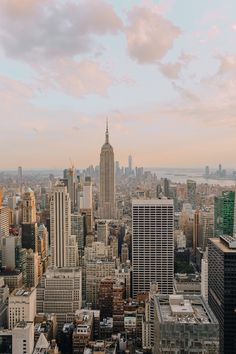 an aerial view of new york city with skyscrapers