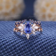 Pear Shaped Cornflower Sapphire Engagement Ring Set 3pcs Art Deco Wedding Rings Women Rose Gold Marquise Diamond Sapphire Wedding Band If you want a men's ring to match this ring, you can take a look at this one. https://www.etsy.com/listing/1535832513/vintage-white-gold-sapphire-mens-rings?click_key= Jewelry Information: ♡ Handmade, high-quality item ♡ Material: SOLID 14K/18K GOLD ( can be made in yellow/white/rose gold ) ♡ Engagement ring ♡ Center stone: Lab grown sapphire  ♡ Size/Weight:  8x6mm  ♡ Cut - Pear Shaped ♡ Color: cornflower blue ♡ Side stones: Moissanite/ Natural diamonds ♡ Weight:  About 0.28ct ♡ Cut - Marquise Shaped ♡ Clarity - SI-VS ♡ Color- G-H ♡ Band Width: Around 1.8mm ♡ Wedding band 1 (top) ♡ Stone: Natural light blue sapphire ♡ Weight: About 0.2ct ♡ Cut - Round Shape Engagement Rings With Blue Sapphire, Shappire Engagement Ring Blue, Wedding Rings Cinderella, Angelite Engagement Ring, Blue Wedding Rings Sets His And Hers, Engagement Rings For Him And Her, Unique Engagement Rings Sapphire Bridal Sets, Opal Sapphire Diamond Ring, Luxe Engagement Rings