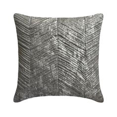 a gray pillow with wavy lines on it