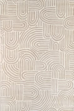 a white rug with an abstract design on it