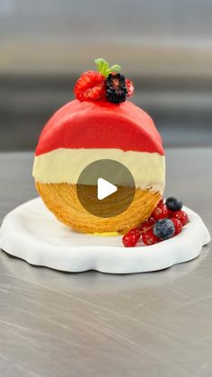 a piece of cake with fruit on top is sitting on a plate and has the video title in front of it