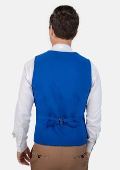 This Royal Blue Vest is designed with stretch cotton for comfort, and features a vibrant royal blue hue that is modern and bold. Looking to stand out and make your presence known? This vest is a great choice. Blue Fitted Vest Top, Blue Sleeveless Vest For Workwear, Blue Sleeveless Vest For Work, Fitted Blue Vest For Workwear, Blue Fitted Vest For Work, Blue Vest Top For Work, Blue Stretch Vest For Spring, Tailored Sleeveless Blue Vest, Fitted Blue Vest Outerwear