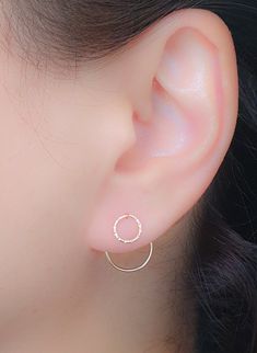 A Pair of Gold Circle Ear Jackets Earrings. Delicate and elegant pair of handcrafted ear jacket earrings, made from a 14k gold filled wire. ► One that looks like TWO → A single earring designed to have the presence as you are wearing 2 earrings. ► Super easy to wear: Thread the large circle end through the front of your piercing until the small circle is on your lobe. Earrings size: Front circle (6mm), Backward circle (12mm) ►Available also in STERLING SILVER and 14K ROSE GOLD FILLED. o o o o Ni Minimalist Wrap Earrings For Anniversary, Dainty Circle Earrings For Pierced Ears, Dainty Circular Earrings, Lobe Earrings, Gold Ear Jacket, Double Earrings, Jacket Earrings, Front Back Earrings, Earrings Circle