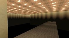 an empty room with lights on the ceiling