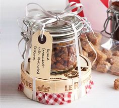 a jar filled with nuts sitting on top of a table