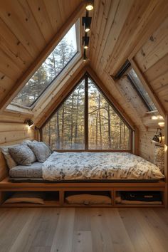 a bed in a room with wooden walls and flooring that is made out of wood