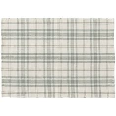 a white and green plaid rug on a white background