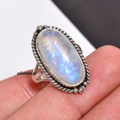 925 Sterling Silver Moonstone Bohemian Handmade Ring, Moonstone Jewelry, Oval Three Bnad Ring, Women Ring, Moon Ring, Rainbow Gift For Her            Moonstone is thought to provide protection to those who travel when the moon is shining . It may enhance intuition and promote inspiration. Moonstone also assists in the acceptance of love. ------------------------------------------------------------------------------------------------------------------------------------ All my Designs are original with 925 Sterling Silver  Size - All Size Ring Stone Name- Rainbow Moonstone Stone Shape- Oval Setting - Bezel Visit For more:-  https://www.etsy.com/in-en/shop/silverindex https://www.etsy.com/in-en/shop/silverindex?ref=seller-platform-mcnav My Spinner Section:- https://etsy.me/3kpiibx My Spinner Handmade Bohemian Oval Moonstone Ring, Bohemian White Oval Crystal Ring, Adjustable Oval Moonstone Bohemian Ring, Bohemian Oval Cabochon Moonstone Ring, Bohemian Sterling Silver Oval Cabochon Moonstone Ring, Handmade Oval Cabochon Moonstone Ring, Oval Moonstone Rings For Jewelry Making, Oval Moonstone Crystal Ring With Natural Stones, Bohemian Silver Moonstone Ring In Oval Cabochon