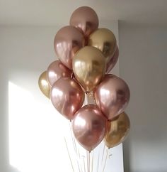 a bunch of balloons that are in the air