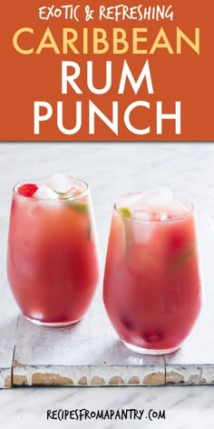 two glasses filled with rum punch sitting on top of a table