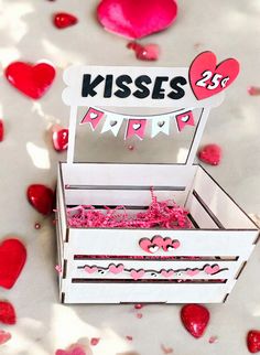 a valentine's day card box that says kisses party with hearts scattered around it