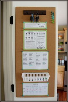 a bulletin board with three pegs attached to it