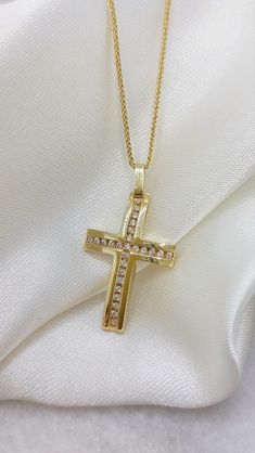 Diamonds Cross Necklace. A handmade 14k or 18k Diamond Gold Cross  with total Diamonds 0,25ct A solid gold cross with a with a shiny surface and a cross created in the center of diamonds. An elegant gold cross ideal as the first jewelry for a baby girls as a baptismal cross and for any other circumstance like wedding - engagement - graduation Details: Height:  30mm Width:17mm Weight:Approximately  4.1gr 14k - 4.6gr 18k Metal:14k or 18k Yellow Gold  Style:Baptism Cross - Bridal Jewelry  ❣️ For mo Yellow Gold Cubic Zirconia Crucifix Jewelry, Yellow Gold Crucifix Jewelry With Cubic Zirconia, Luxury Crucifix Jewelry For Anniversary, Gold Diamond Crucifix Jewelry, Yellow Gold Cubic Zirconia Cross Jewelry, Yellow Gold Cubic Zirconia Cross Pendant, Gold Cross Pendant Jewelry With Diamond Accents, Gold Jewelry With Diamond Accents And Cross Shape, Gold Jewelry With Diamond Accents Cross Pendant