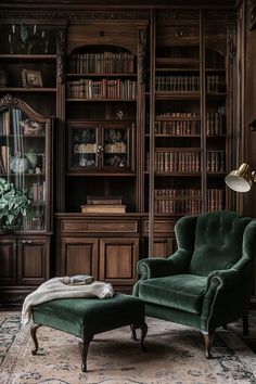 a green chair sitting in front of a bookshelf