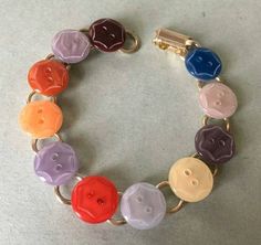 a colorful bracelet with lots of buttons on it