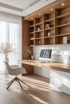 a modern home office with wooden shelves and shelving units in the corner, along with a white chair