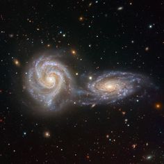 two spiral galaxy like objects in the sky