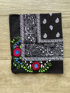 Mexican bandana Are you having a fiesta? Make sure to steal the show with this beautiful embroidered bandana. Wear it around your neck or hair. Perfect for those days at the beach. Each one is unique, if you want to see the ones in stock, please send us a message before placing your order 100% cotton. Size: 19 x 19 inches approx Care: cold water wash, hang to dry Hand embroidered in Mexico Please notice that the bandana is made in China, but all the embroidery is hand embroidered in Mexico by ta Summer Cotton Patterned Bandana, Summer Festival Paisley Print Bandana, Bohemian Bandana Print Scarves For Summer, Traditional Cotton Bandana, Summer Cotton Bandana With Paisley Print, Summer Bandana Print Patterned Scarves, Summer Cotton Bandana Print Scarves, Bohemian Cotton Bandana For The Beach, Bohemian Bandana For Beach In Summer