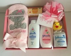 a pink box filled with personal care items and a rubber ducky on the side