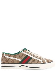 Women's Gucci Sneakers - White - Low-top sneakers 2 cm (0.8") heel Green and red panel with Gucci logo Breathable hole Embossed logo on the tab Embossed GG logo on the front of the sole Embossed GG logo on the bottom of the sole. While Gucci is known for its sophisticated aesthetic, it also presents more casual pieces, such as this textile trainer featuring the label's iconic GG logo. Comfortable and timeless in design, these flat-sole trainers are both cool and practical. Slip into this latest Red Panels, Gucci Sneakers, Sneakers Collection, White Sneakers Women, Buy Gucci, Brown Sneakers, Womens Tennis, Adidas Gazelle Sneaker, White Trainers