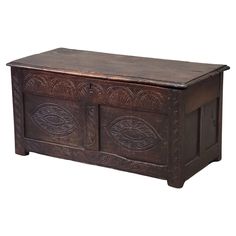 an old wooden chest with carvings on it