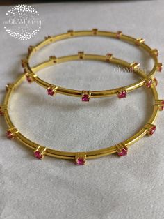 Bangle made with lab created ruby cut stones. Made in guaranteed pure sterling silver 925, stamped and marked with real gold 18K filling to enhance the durability. Please refer the image to check your size to order. Gold Filling is completely different from Gold Plating as gold filling contains 100% gold which does not go away easily and enhances the life and look of the jewelry. Gold Ruby Bracelet In Temple Jewelry Style, Gold Ruby Bracelets In Temple Jewelry Style, Gold Ruby Jewelry Hallmarked, Classic Gold Bangle With Gemstone, Gold Ruby Round Jewelry, Gold Ruby Jewelry, Gold Ruby Jewelry With Round Shape, Hand Set Ruby Bracelets In Gold, Gold Ruby Bracelets With Hand Set Stones