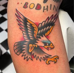 an eagle with the word boohin on it's arm is seen in this photo