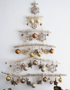 a christmas tree made out of branches and ornaments