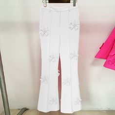 Elevate your casual wardrobe with the stunning Danielle Flower Pants, a designer-inspired high-waisted, wide-leg trouser that's perfect for any spring or summer occasion. The solid patchwork design of these pants is complemented by beautiful flower appliques, creating a unique and eye-catching look that's sure to turn heads. Crafted from a blend of cotton and polyester, these pants are both comfortable and durable, while the slight stretch ensures a perfect fit. The high waist and wide leg silho Pink High-waisted Floral Pants, Elegant Pink High-waisted Pants, Luxury Pink Wide Leg Pants, Luxury High-waist Pink Pants, Luxury Pink Full-length Pants, Flower Pants, Trousers For Women, Summer Pattern, Loose Fabric