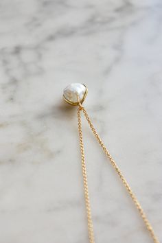 This necklace features a beautiful white baroque cultured freshwater pearl (AAA) set in 18 k solid gold that hangs from a delicate and high quality gold filled chain. This necklace is a timeless piece that makes a perfect gift for many occasions. Pearl is the birthstone for the month of June and makes a lovely birthday gift as well. Minimal simple design, effortlessly chic. Wear it on its own or layer it with other necklaces. Made using the highest quality USA and UK sourced materials. 📦 Eco-friendly packing I try my best to use as little plastic as possible in my packaging. Each order will arrive wrapped in a sweet eco-friendly and biodegradable glassine paper bag, ready for gift giving.  I use ONLY 100% recyclable mailers and 100% biodegradable product packaging. D e t a i l s : => Meta Yellow Gold Necklace With Pearl Drop And Round Pendant, Fine Jewelry Pearl Necklace With Round Pendant, Fine Jewelry White Necklaces With Pearl Charm, Dainty Akoya Pearl Pendant Jewelry, Delicate Baroque Pearl Necklace With Delicate Chain, Yellow Gold Pearl Jewelry With Pearl Pendant, Yellow Gold Pearl Pendant Jewelry, Formal Pearl Charm Necklace, White Gold Briolette Pearl Pendant Necklace