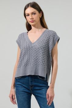 Add a fun vibe to all your favorite look, adding the Tacey V-Neck Sweater Vest Top. A knit textured features a v-neck that tops a sleeveless, box fit bodice. It's knitted in a mixed pattern to create the perfect texture. Pair it with denim and boots for a casual 'fit.- V-neck- Drop sleeve- Cable knit- Oversized armhole- Comes in 2 colorsSize + Fit - Model is 5'11" and wearing size XS- Measurements taken from size S - Chest: 20"- Length: 20 1/2" Fabric Self: 99% Acrylic 1% Nylon Style Number STT1 Casual V-neck Cable Knit Sweater Vest, Casual V-neck Vest For Loungewear, Spring Cable Knit V-neck Tops, Spring Gray Knit Sweater Vest, Gray Knit Sweater Vest For Spring, Casual Cable Knit V-neck Sweater Vest, Casual Textured Knit Tank Top For Fall, Gray V-neck Sweater Vest For Layering, Gray V-neck Sweater Vest For Spring