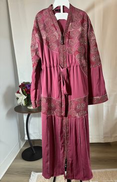 abaya for muslim girls. Comes with a hijab Long Sleeve Dabka Dresses For Eid, Long Sleeve Dresses With Dabka For Eid, Traditional Pink Maxi Length Abaya, Traditional Pink Floor-length Abaya, Traditional Floor-length Pink Abaya, Modest Pink Abaya For Spring, Pink Modest Abaya For Spring, Eid Tunic Dress With Dabka Details, Dabka Tunic Dress For Eid