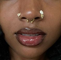 Gold Cheek Piercing, Large Nose Ring, Gold Septum Aesthetic, Two Nose Rings On Both Sides, Gold Nose Stud Aesthetic, Unique Ear Piercings Ideas, Symmetrical Nose Piercing, Gold Septum Piercing On Black Women, Unique Face Piercings