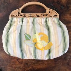 Banana Republic Handbag With Wood Carved Handles, Yellow, Beige, Green, And Cream Stripes With Embroidered Flowers. Adorable Accessory For Any Wardrobe. The Perfect Bag For Brunch Or Lunch!! 15” From Left To Right 12” From Top To Bottom Of Bag. Interior Zip Pocket Retail $60.00 Plus Tax Summer Hobo Bag With Detachable Handle, Vintage Shoulder Bag With Removable Pouch For Summer, Spring Pouch Shoulder Bag, Vintage Bags For Everyday Use In Summer, Spring Pouch Shoulder Bag With Handles, Yellow Handheld Hobo Bag For Daily Use, Retro Beige Shoulder Bag For Spring, Yellow Spring Pouch Bags, Yellow Pouch Bags For Spring