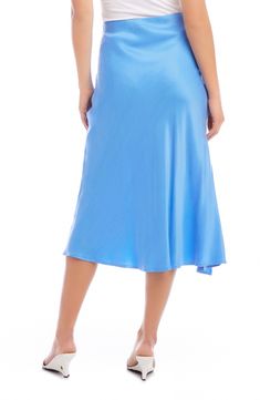 A vibrant solid hue emboldens this wrapped skirt tethered with a defining side tie. 33" length (size Small) True wrap style with side tie closure Unlined 53% cupro, 47% viscose Dry clean Made in the USA of imported fabric Blue Asymmetrical Flowy Wrap Skirt, Fitted Blue Asymmetrical Wrap Skirt, Chic Fitted Blue Wrap Skirt, Blue Draped Skirt For Summer, Blue Flowy Lined Wrap Skirt, Blue Silk Relaxed Skirt, Blue Asymmetrical Wrap Skirt For Spring, Chic Blue Lined Wrap Skirt, Fitted Blue Bottoms With Side Ties