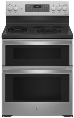 two silver ovens side by side with the top one open and the bottom one closed