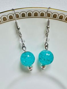 Dazzle with the stunning Aqua Cloud Murano Dangle Earrings. Featuring Venetian Murano glass beads set in silver findings with crystal and silver-toned earring hooks. These make the perfect gift for a special occasion such as weddings, anniversaries and birthdays for someone special. Nickel-free Glass Beaded Dangle Earrings, Nickel-free Dangle Glass Earrings, Nickel-free Glass Dangle Earrings, Hypoallergenic Czech Glass Drop Earrings, Silver Czech Glass Beaded Earrings With Ear Wire, Hypoallergenic Czech Glass Dangle Crystal Earrings, Silver Dangle Earrings With Czech Glass, Silver Glass Earrings With Ear Wire, Silver Czech Glass Beaded Round Earrings