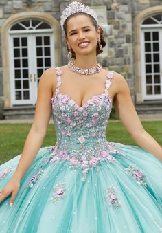 Be photo ready in breathtaking style 60176 by Vizcaya. The fitted corset bodice has a sweetheart neckline and is adorned in eye catching applique and beaded details that make an appearance on the voluminous glittering tulle skirt. Quinceanera Ball Gown With Sheer Fitted Bodice, Quinceanera Gown With Sheer Bodice And Sweetheart Neckline, Quinceanera Tulle Gown With Sweetheart Neckline, Tulle Gown For Quinceanera With Sweetheart Neckline, Tulle Gown With Sweetheart Neckline For Quinceanera, Ball Gown With Sheer Fitted Bodice For Quinceanera, Fitted Quinceanera Dress With Corset Back And Sweetheart Neckline, Fitted Quinceanera Dress With Lace Bodice And Sweetheart Neckline, Embellished Ball Gown With Sweetheart Neckline