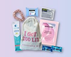 an assortment of personal care items in a drawstring bag on a purple background