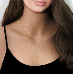 "Gold Beaded Lariat Necklace, Minimal Necklace, Gold or Silver Lariat, Beaded Necklace, Girlfriend Gift, Y Necklace  Gold or Silver Lariat Necklace This Y Necklace is absolutely adorable Makes an everlasting impression with its chic style and eye catching beads.  * High Quality Gold  or Silver Plated over brass Satellite Chain  * Each bead is 3mm spaced every 1\" * Photo #1 is shown at 16\" To View More Lariat Necklaces, Click Here: https://www.etsy.com/shop/SimpleAndLayered?section_id=16420368&ref=shopsection_leftnav_3 All orders are sent packaged in a jewelry box - ready to be gifted! Upon request, we can also include a note card with your own personal message. PLEASE NOTE: In an effort to be greener and to keep shipping costs down, your order will arrive in ONE (1) gift box regardless o Dainty Lariat Charm Necklace With Delicate Chain, Delicate Lariat Charm Necklace, Gold Y-shape Clavicle Chain Necklace, Gold Y-shape Chain Necklace With Adjustable Chain, Gold Y-shape Adjustable Chain Necklace, Gold Y-shape Delicate Chain Necklace, Double Strand Long Necklace Gift, Double Chain Lariat Necklace, Gold Lariat Clavicle Chain Necklace