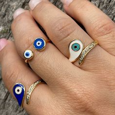 Ring Evil Eye, Eye Ring With CZ, Gold Plated Eye Ring, White And Blue Colors, Adjustable Ring, Evil Eye Ring, Joint Rings, Statement Rings, Minimalist Style, Greek Evil Eye Ring, Mexican Evil Eye Ring, Protection Ring, Lucky Eye Ring, Anillo De Mal De Ojo, Nickel Free, Hypoallergenic. Please Also Check Out Our Other Ring Options 👇🏼 https://www.etsy.com/shop/ShineOnYouStore?section_id=29271417 This evil eye ring is ADJUSTABLE. This is suitable for every sizes. This evil eye ring can be used as JOINT RINGS as well. It is completely Handmade. Evil Eye...🧿 It is a BLUE bead used as a talisman which is believed that it would PROTECT you against the Evil-eye. Evil-eye superstition comes from very early times and it can be found in most of the cultures in the world. To prevent this unfortunate Blue Crystal Open Ring For Promise, Blue Adjustable Crystal Promise Ring, Adjustable Blue Crystal Promise Ring, Blue Open Crystal Ring For Promise, Blue Open Crystal Ring, Blue Stackable Enamel Ring, Blue Open Ring, Adjustable Blue Stackable Crystal Ring, Blue Open Midi Rings