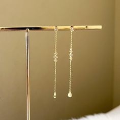 Our Alba Drop Earrings are dainty drop earrings featuring charming arrangement of different shapes of sparkly cubic zirconia. Wear the two styles together; they are perfect for adorning ears with multiple piercings! 18K Gold Plating or Platinum Plating on 925 Sterling Silver with cubic zirconia Long: a little less than 3 in. Medium: a little less than 1.5 in. LAST CHANCE = FINALSALE Minimalist Cubic Zirconia Dangle Earrings, Minimalist Cubic Zirconia Dangle Linear Earrings, Diamond Dangle Crystal Earrings For Pierced Ears, Diamond Crystal Dangle Earrings For Pierced Ears, Sparkling Cubic Zirconia Linear Dangle Earrings, Sparkling Stone Dangle Linear Earrings As Gift, Hypoallergenic Diamond Dangle Earrings, Minimalist Diamond White Dangle Earrings, Elegant White Gold Earrings With Dangling Charms