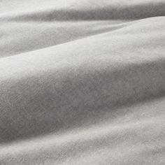 a close up view of a plain grey fabric