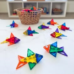 colorful origami fish are arranged on the table