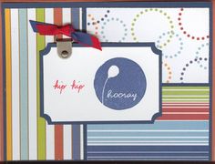 a close up of a card with a tag on it and a ribbon around the top