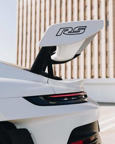 the rear end of a white sports car