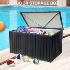 an outdoor storage box filled with beach balls next to a swimming pool and inflatable floats