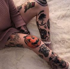 a person with tattoos on their legs and feet