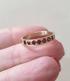 Solid gold Garnet half eternity ring, Garnet stacking ring, stacking gemstone rings, January birthstone ring, Garnet gold ring Solid gold, handmade half eternity stacking ring, stoned with 7 beautiful deep red gemstones. This multistone ring is beautiful alone or stacked together with other rings and is colorful and pretty on your finger. The ring is available in 9k or 14k solid gold- yellow, white or rose. It is also available in nickel free, 14 karat gold plating over brass or silver and in so Garnet Gold Ring, Red Engagement Ring, Gold Garnet Ring, January Birthstone Rings, The Bling Ring, Dope Jewelry, Etsy Gold Ring, Half Eternity Ring, Solid Gold Ring